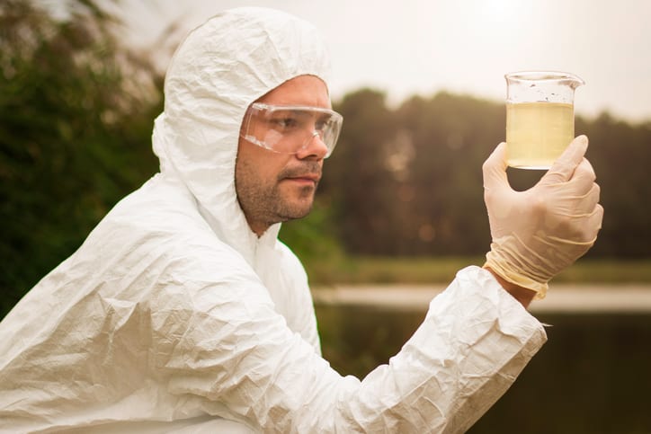 Scientist examining toxic water
